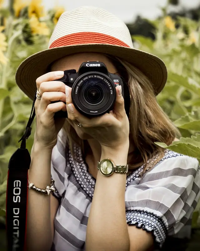 A photographer taking a photo of plants